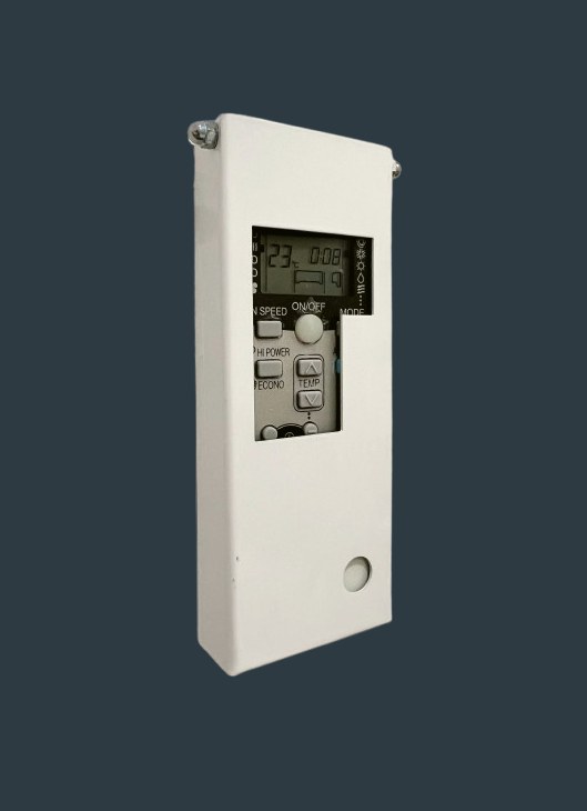 The powder-coated metal box a central Madrid hotel built around its AC remote, with a cutout exposing only some buttons and the display showing 23°C